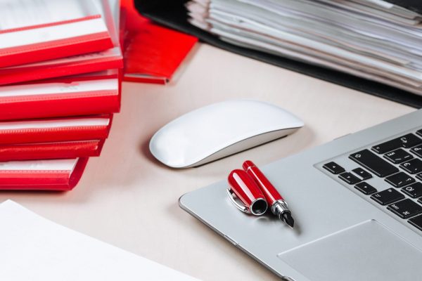 office-working-place-laptop-pen-mouse-folder-table