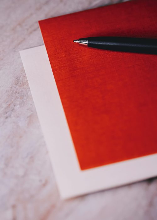 Pen and papers as office stationery, closeup